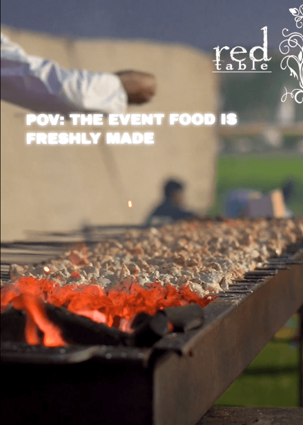 Live BBQ station at a Red Table event